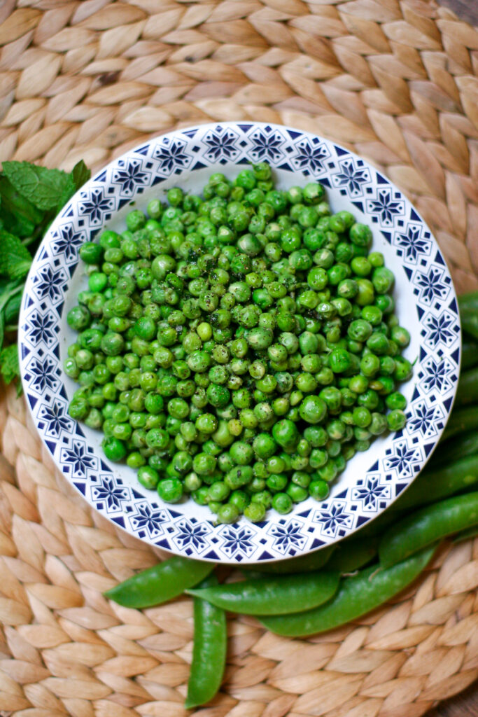 Minty Shelled Peas in a White Bowl with Blue Trim